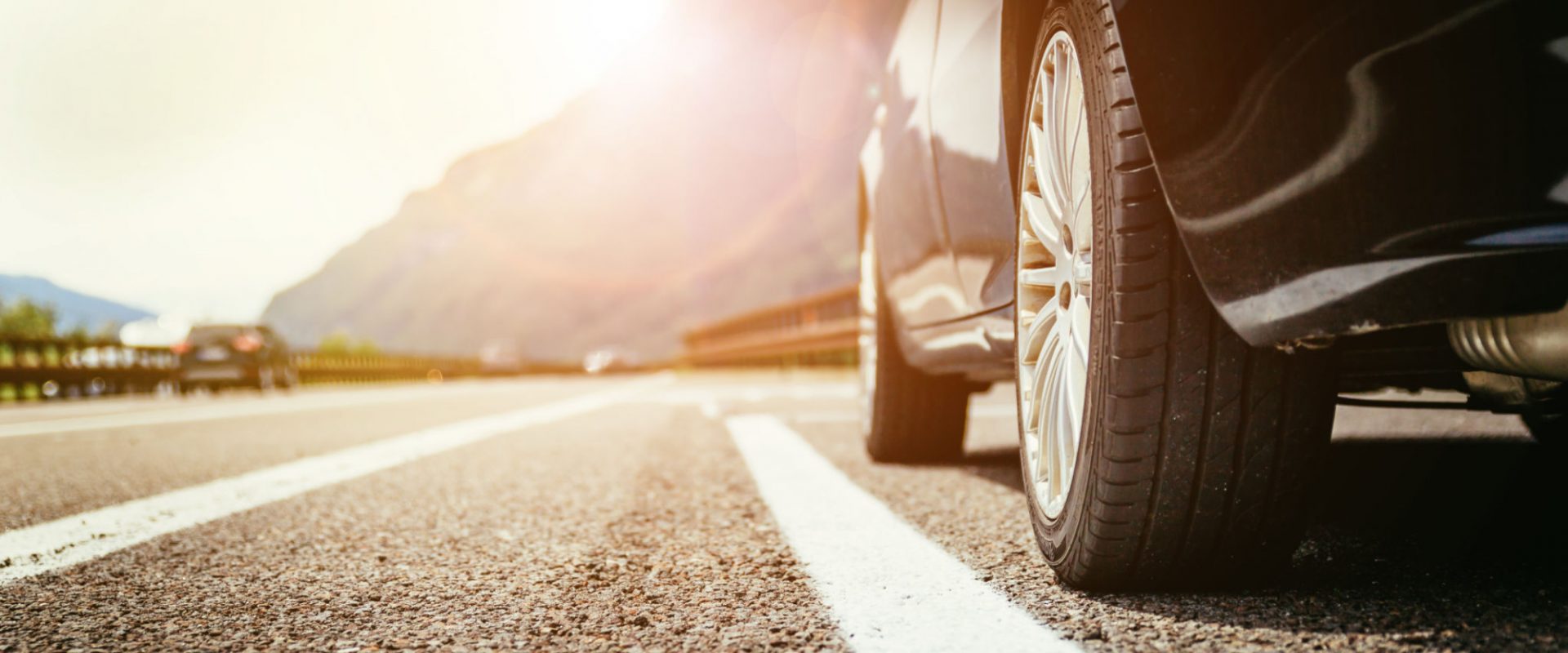 Close up of a car standing on a breakdown lane, summer vacation