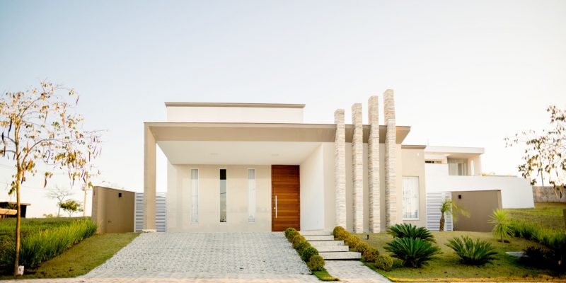 Stylish facade of a modern home with contemporary architectural features on a late afternoon in the summertime